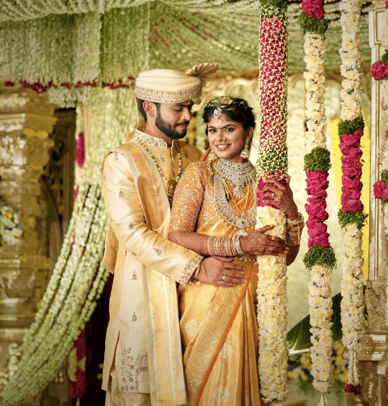 Full moon visible through silhouetted palm fronds at night.