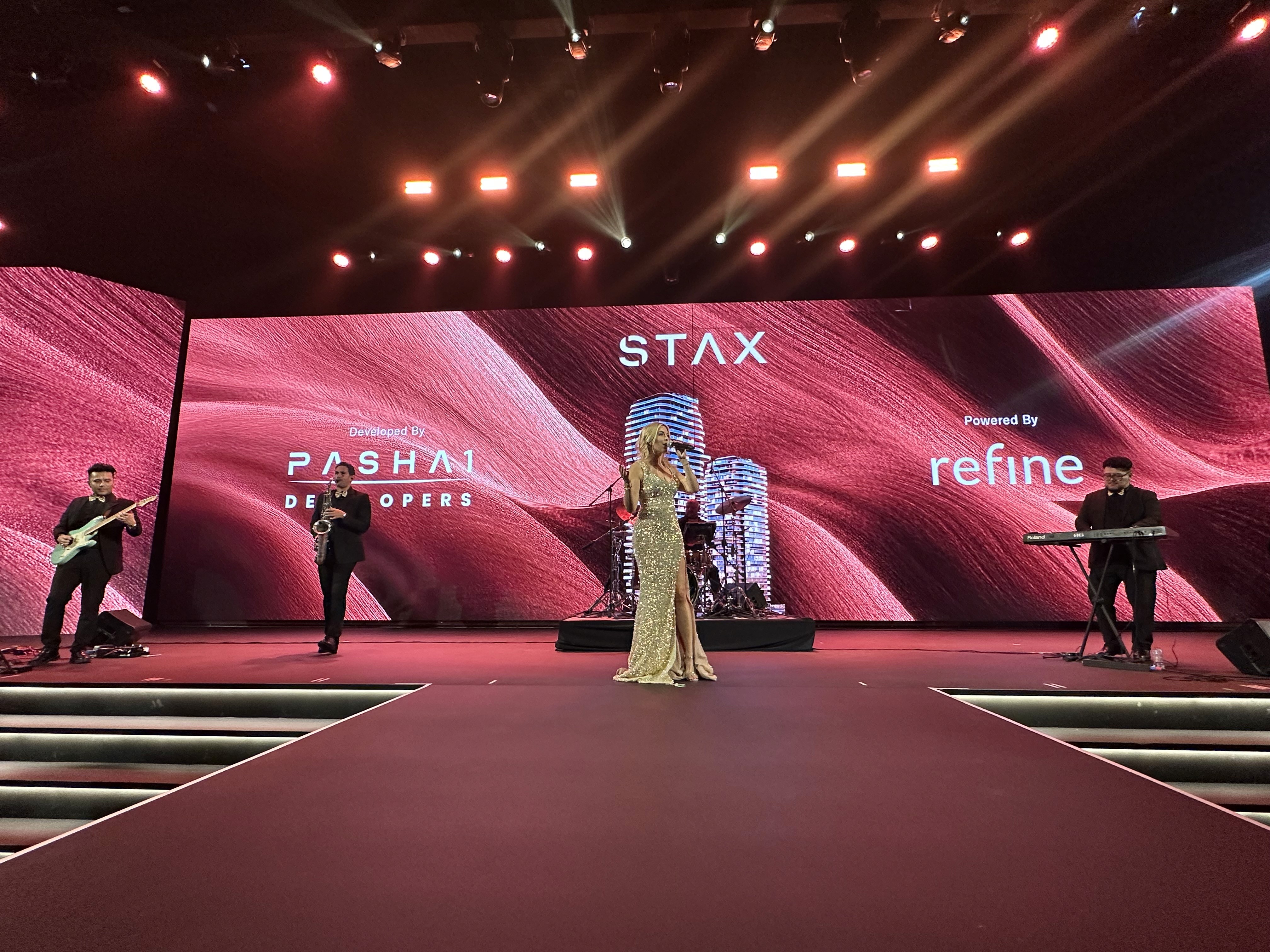 Real estate launch entertainment in Dubai with live performers, screen visuals, branded stage, and corporate event entertainment.