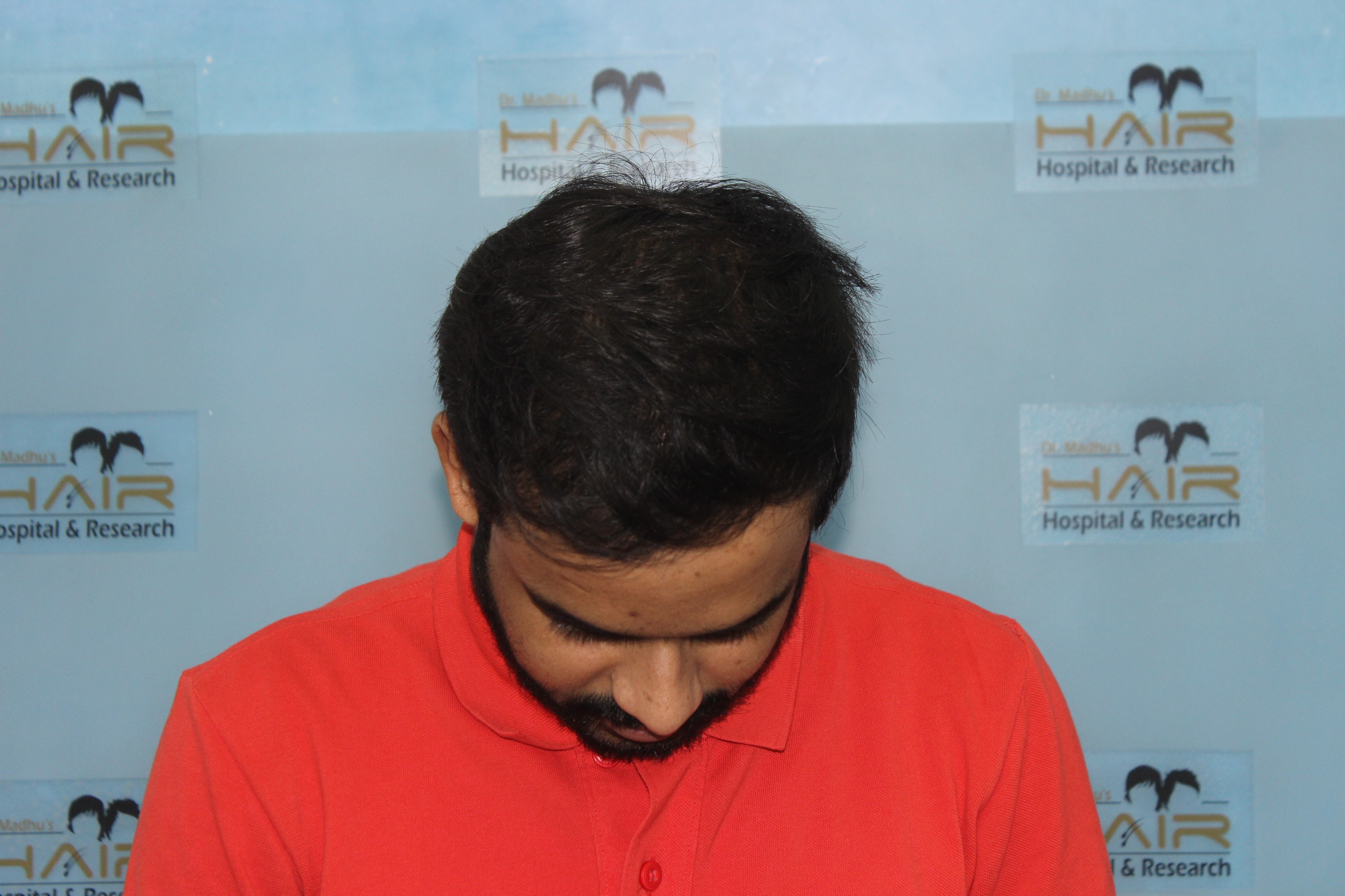 man in black and white nike zip up jacket smiling