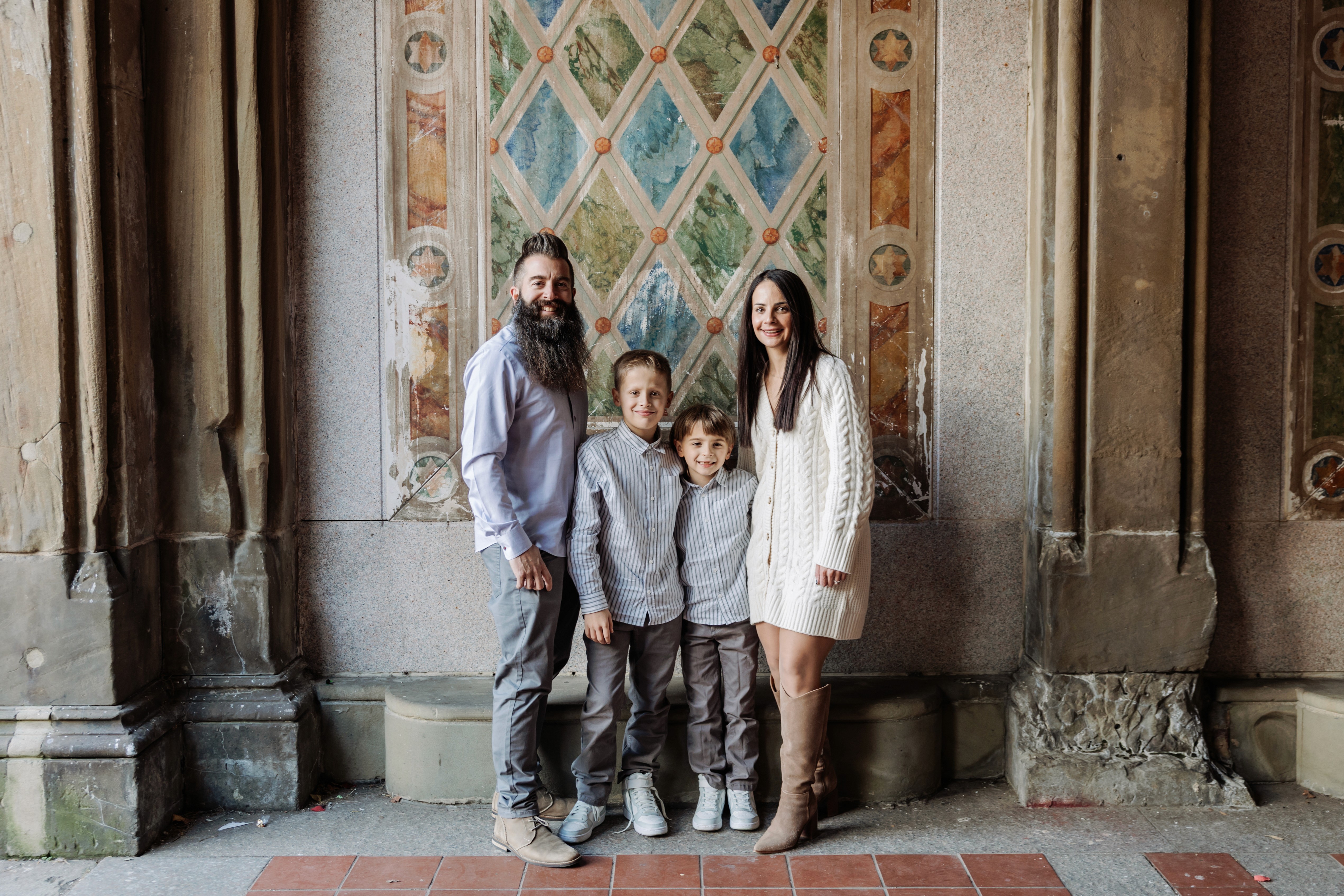 6:13 PMNewly engaged couple sitting on a stoop in the West Village, NYC bathed in warm golden hour light — romantic, candid golden hour engagement photography by Lizz Spano Photography, New York City engagement photographer.