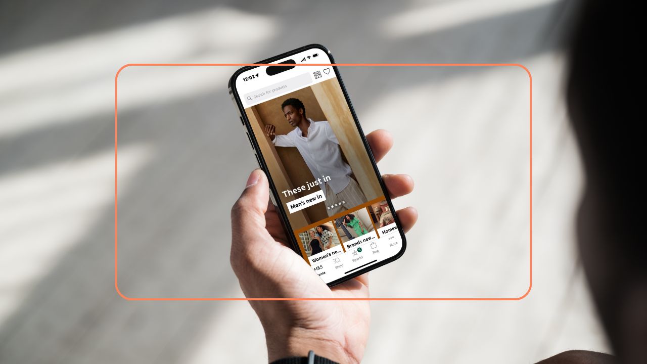 Person browsing an online fashion store on a smartphone