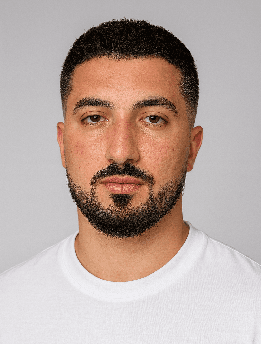 headshot of male in dark background