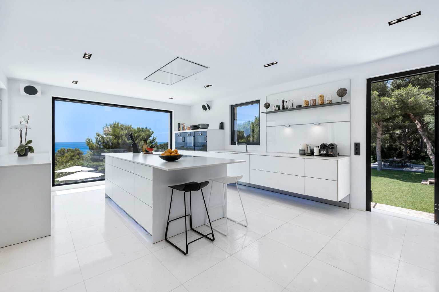 Exclusive luxury villa Ibiza indoor kitchen and dining area—private VIP estate property holiday retreat