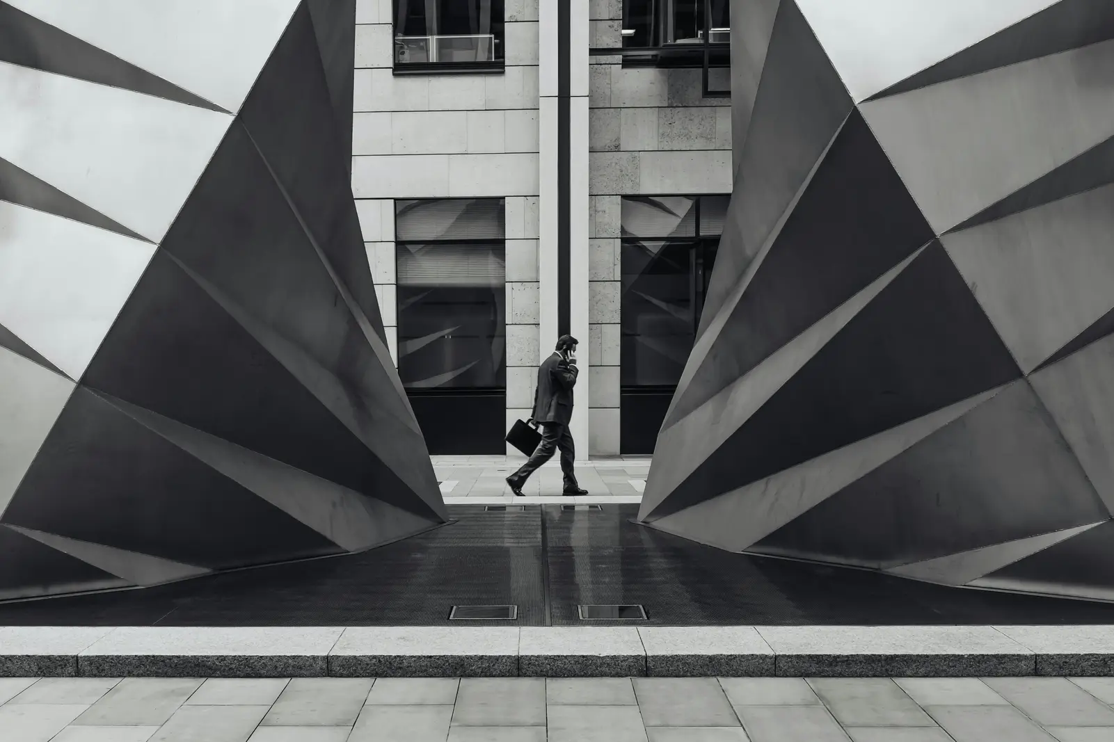 Businessman on a walk among architecture.