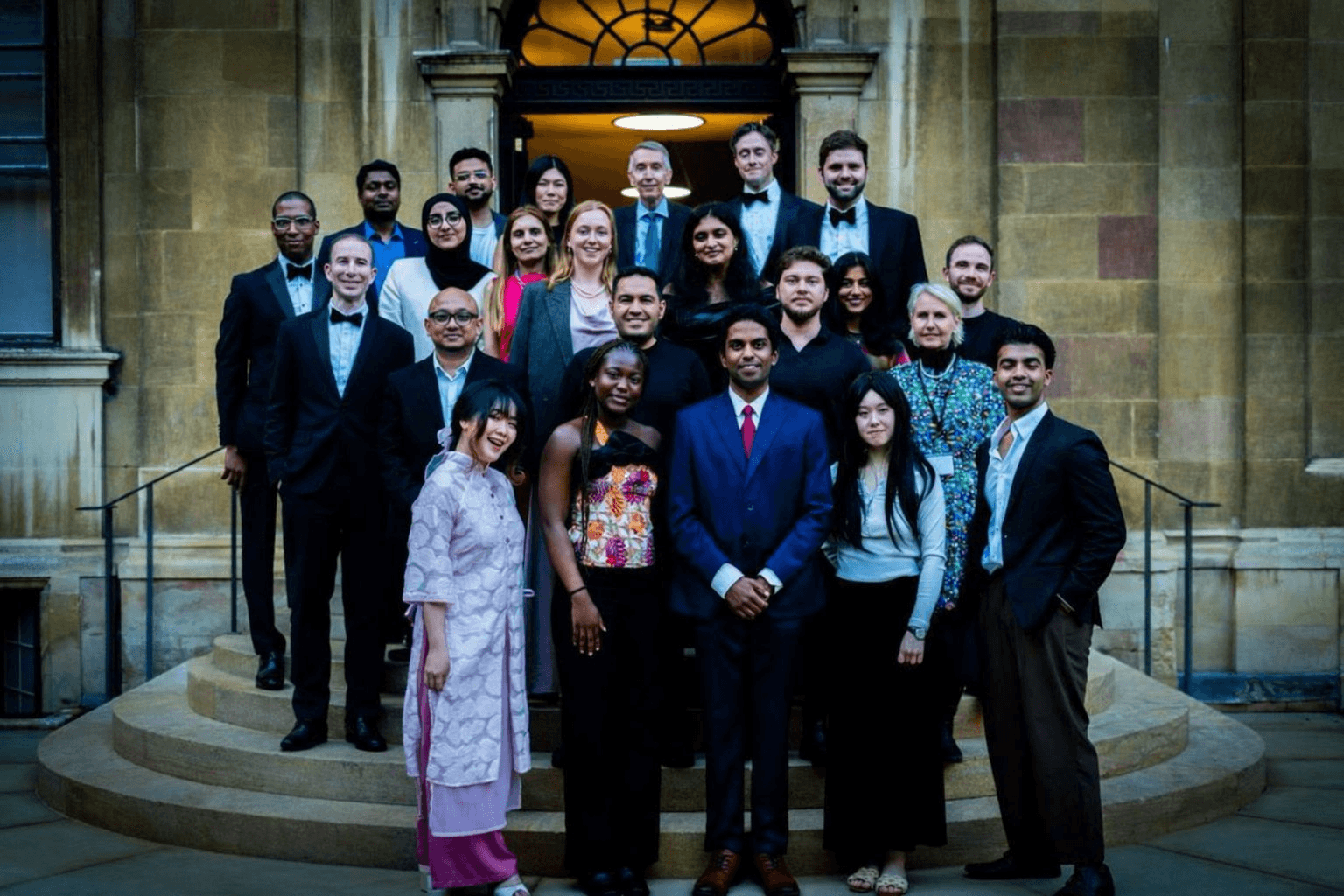 Modern office interior with glass walls, wooden accents, and a person walking up a staircase in motion blur.