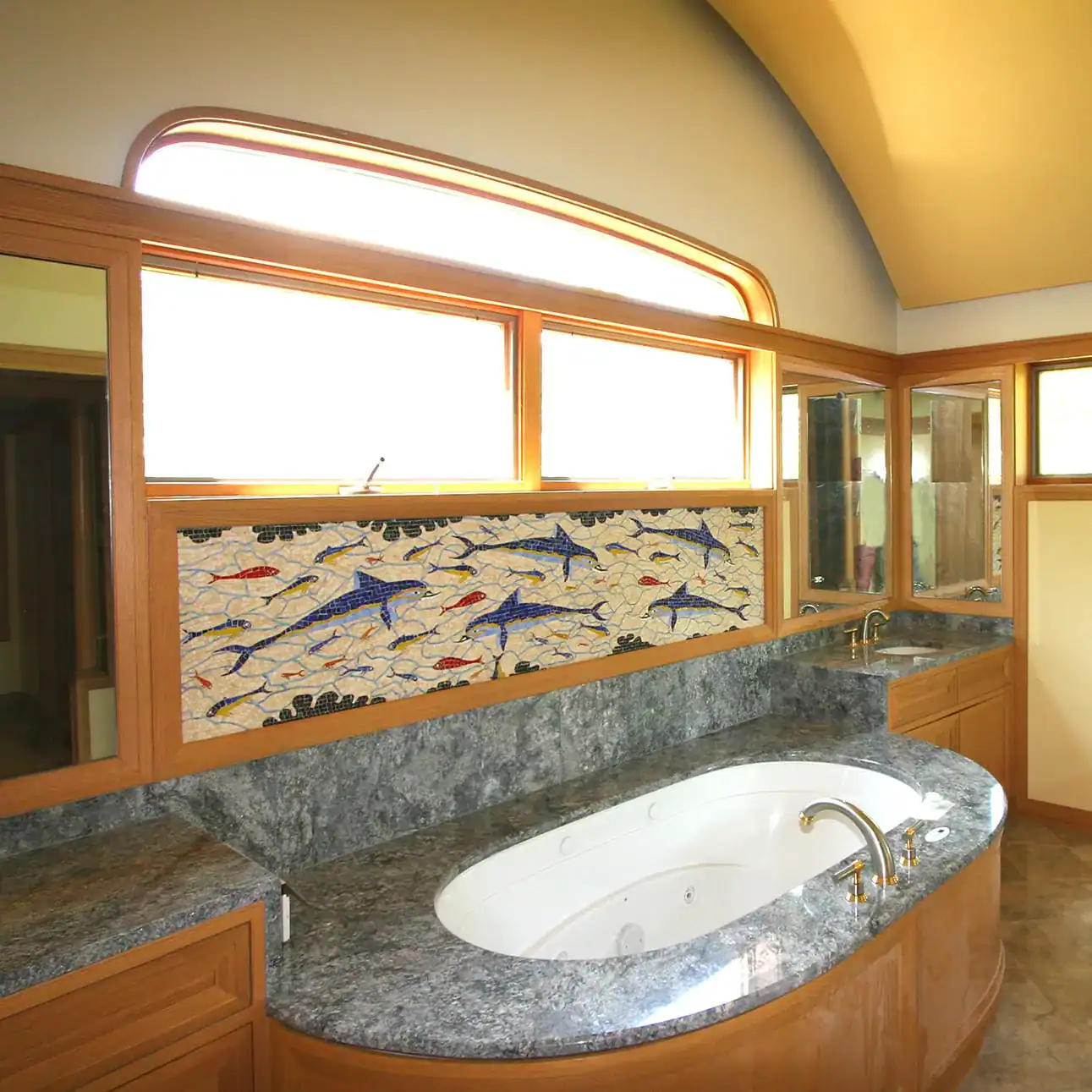 Dolphin frieze after the Minoan fresco in the Queen's Megaron at Knossos, installed as a mosaic backsplash above a bathtub.
