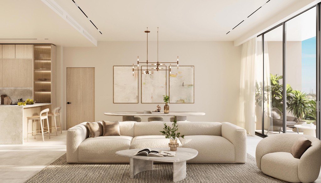 A contemporary living room that includes a kitchen and dining area, designed for comfort and modern aesthetics.