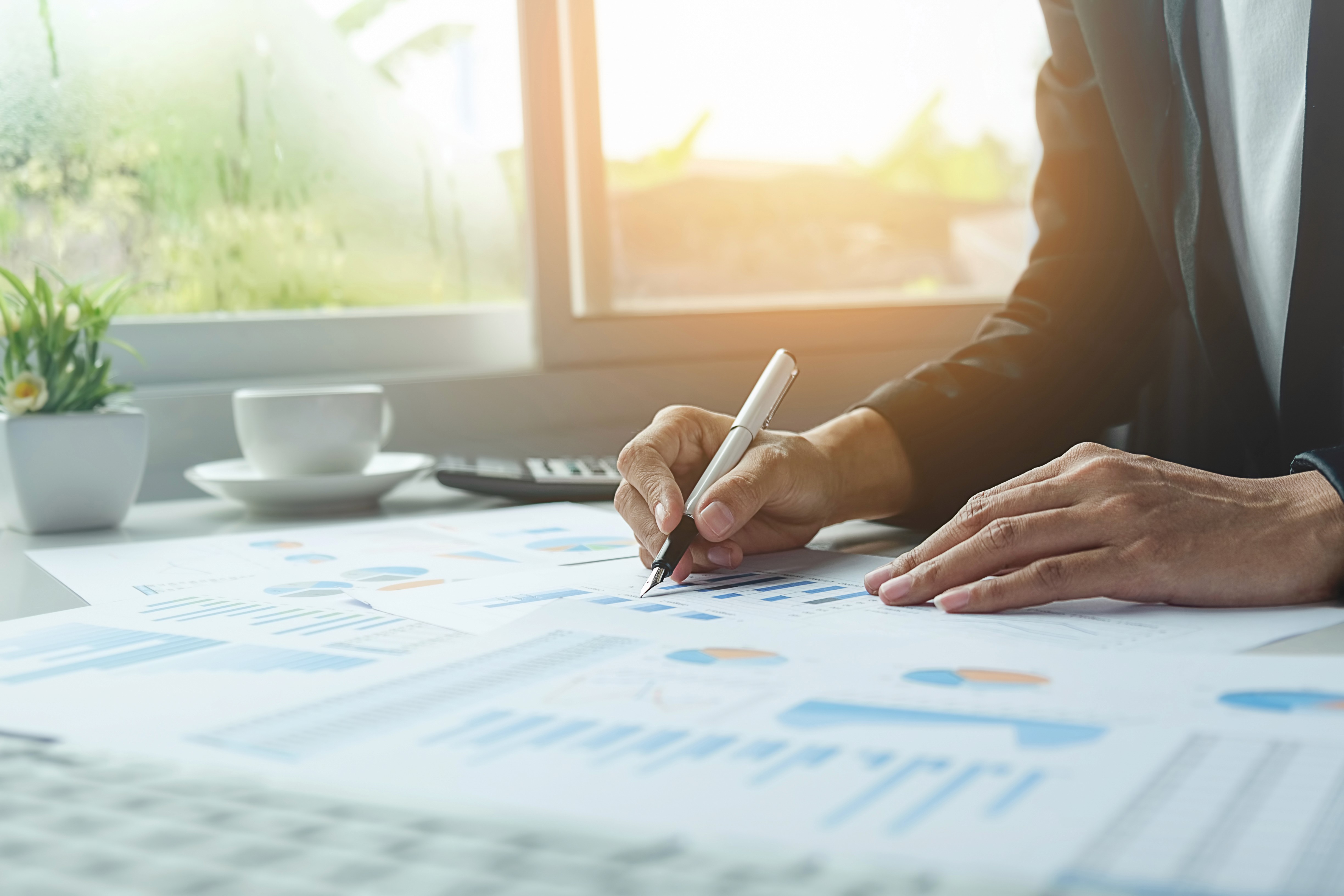 A price tag on a desk with a laptop and tablet
