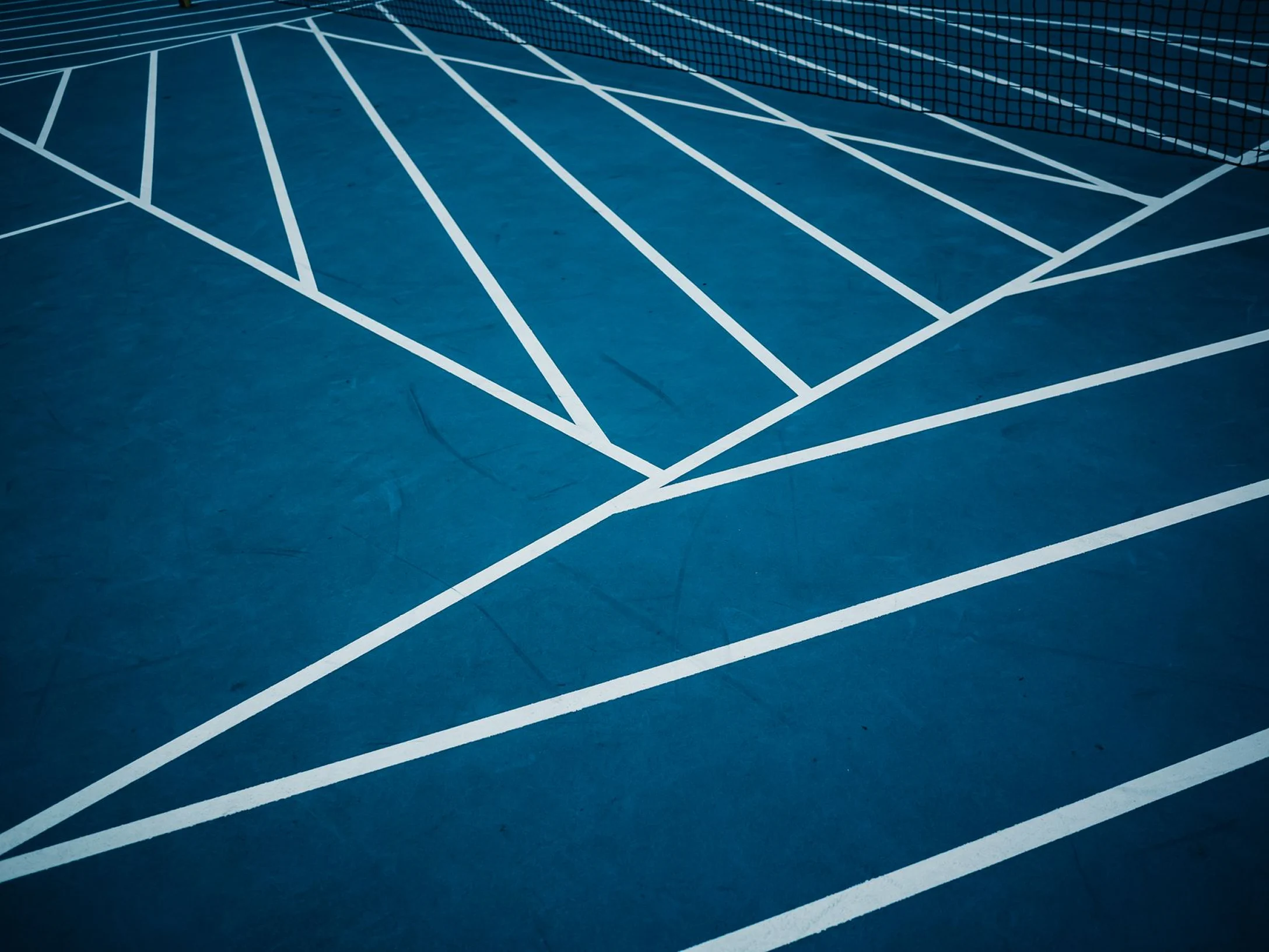 Clay tennis courts at sunset