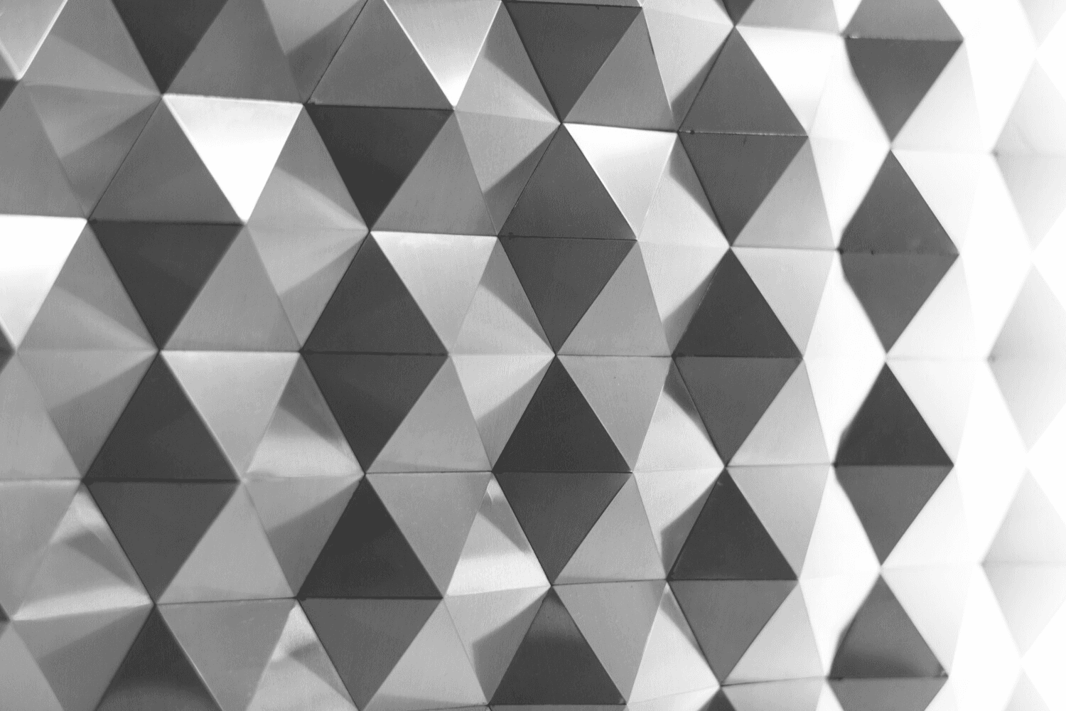 A close up of a white wall with a clock on it