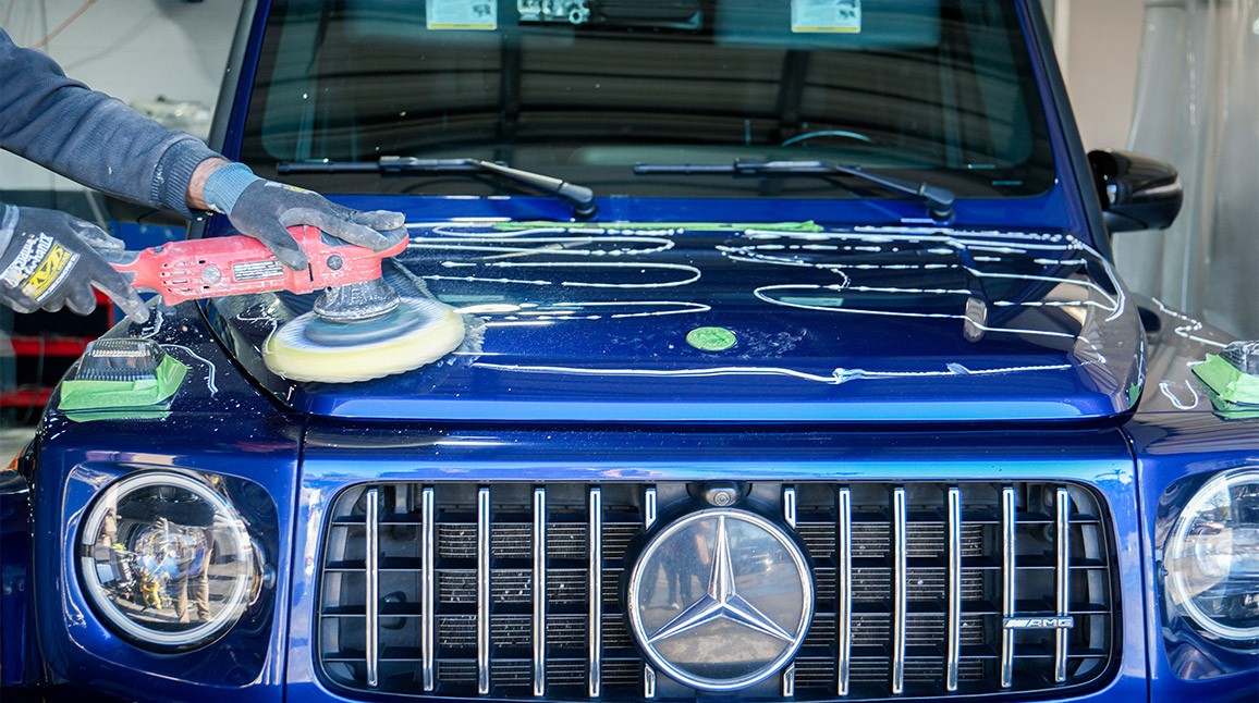 Close-up of Mercedes-Benz G-Class front grille during collision repair at Auto Body Unlimited.