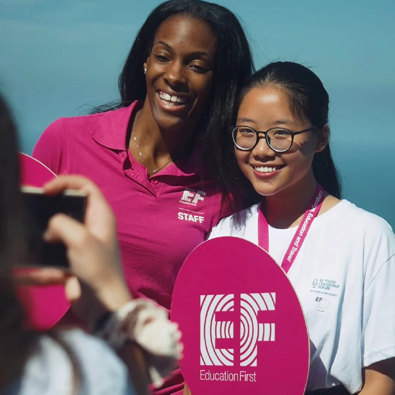 Institutional photography of a professional athlete and a student during EF Youth Leadership Forum