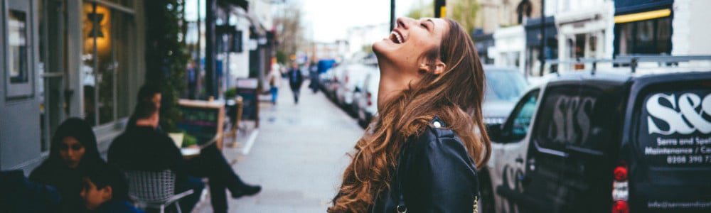 Happy girl smiling on the street