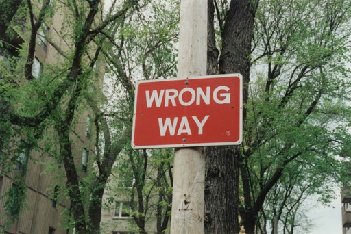 Wrong way road sign, illustrating common mistakes Americans make when moving to France