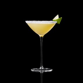 A closeup of a Marilyn Martini drink against a dark background.