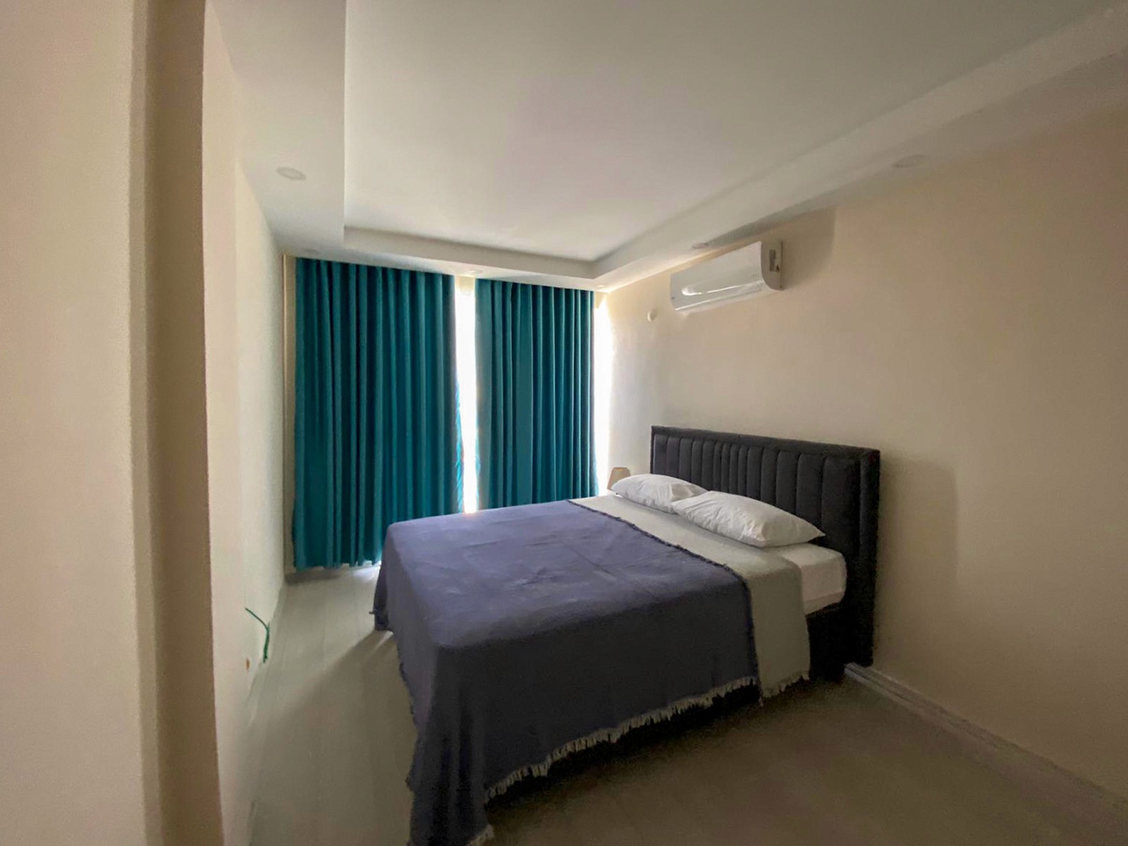 Bedroom interior of duplex 1 bedroom apartment at Zen Garden Suites Side Antalya