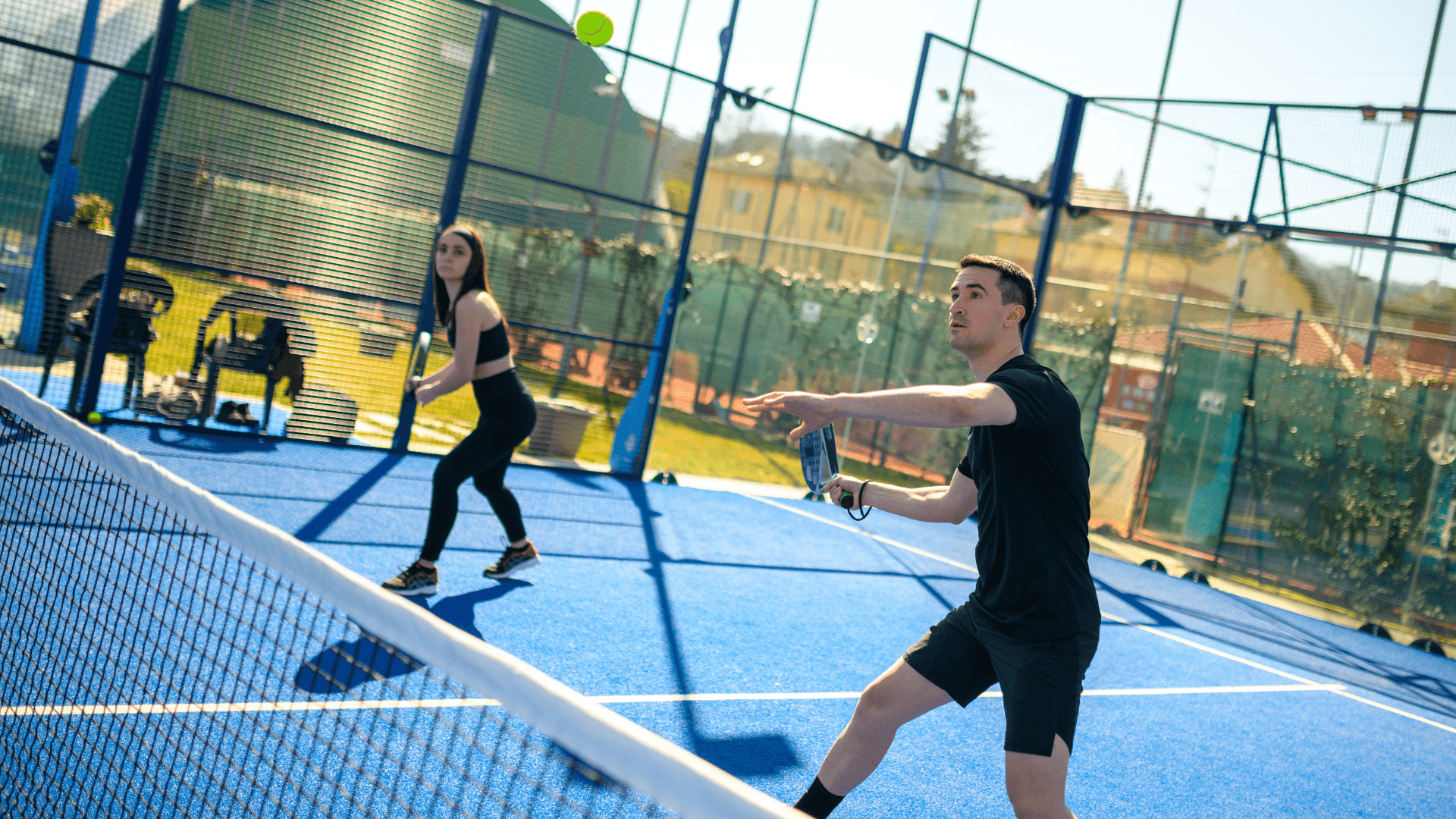 A couple playing padel