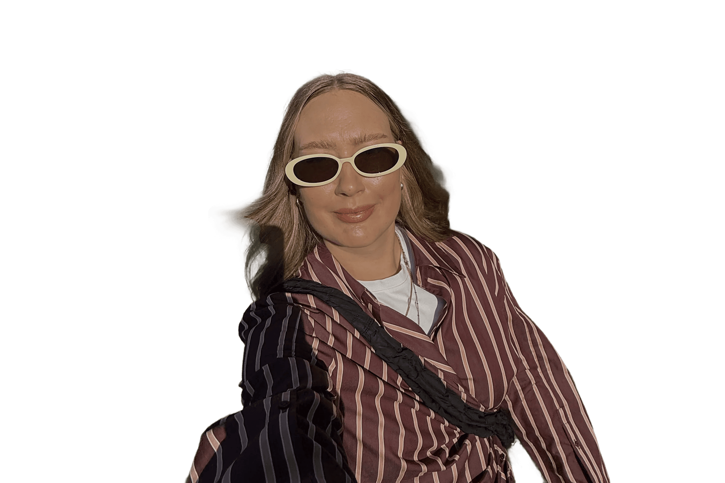 Smiling Joanna Cieszyńska wearing sunglasses and a striped shirt - no background