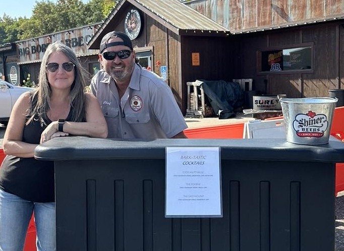 Someone petting dog's chin