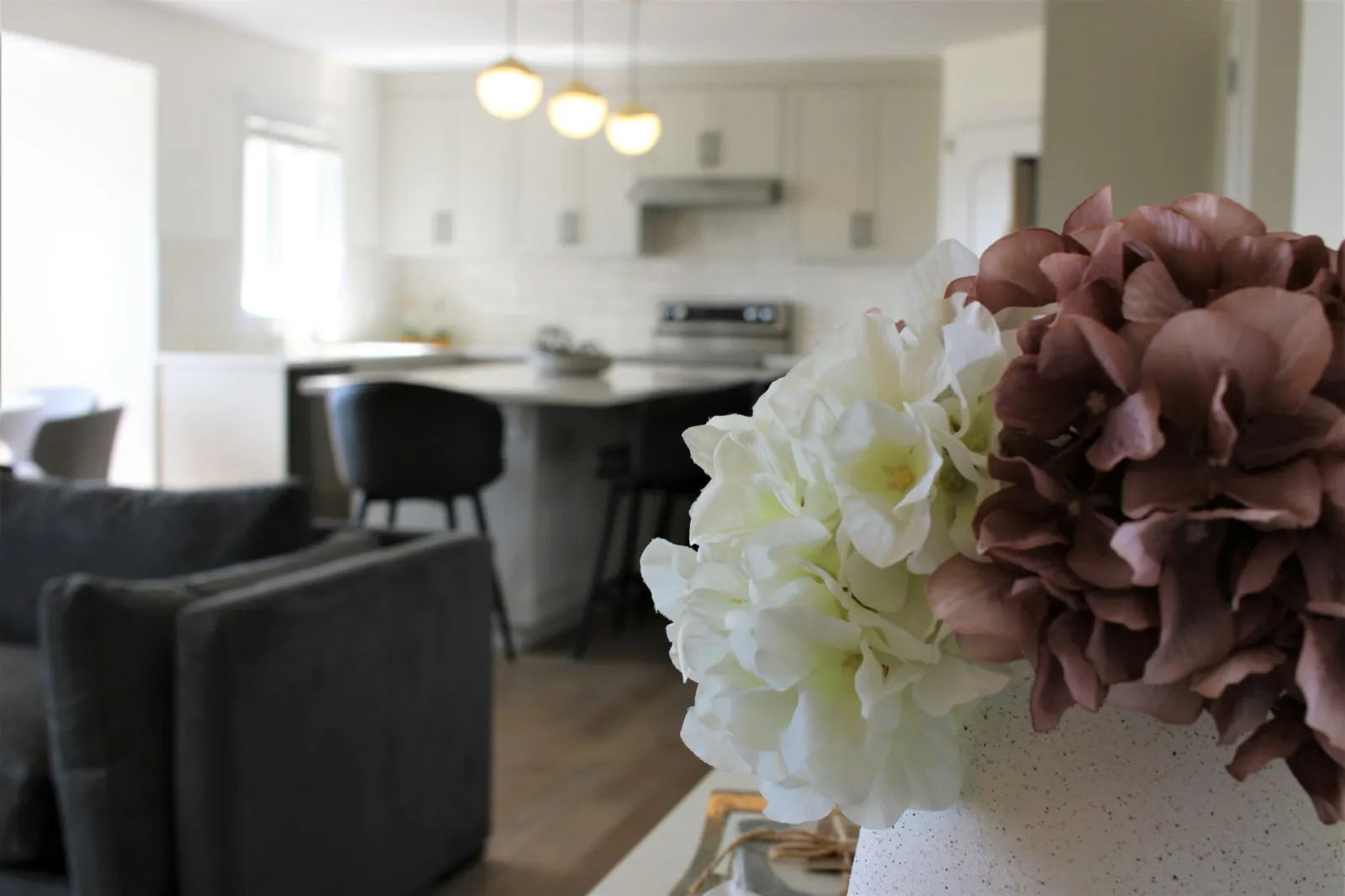 Image of flowers in front of kitchen.