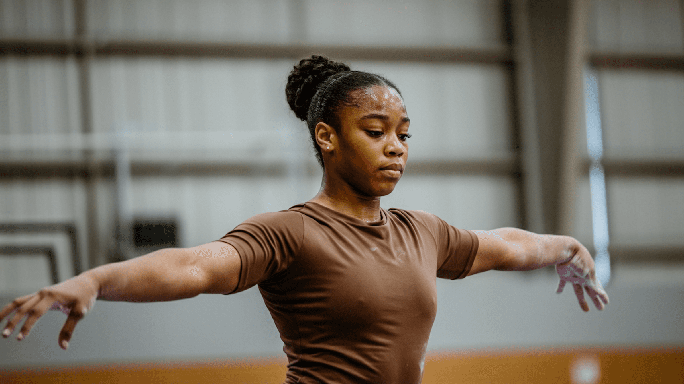 Woman performing strength training exercise with focus and control