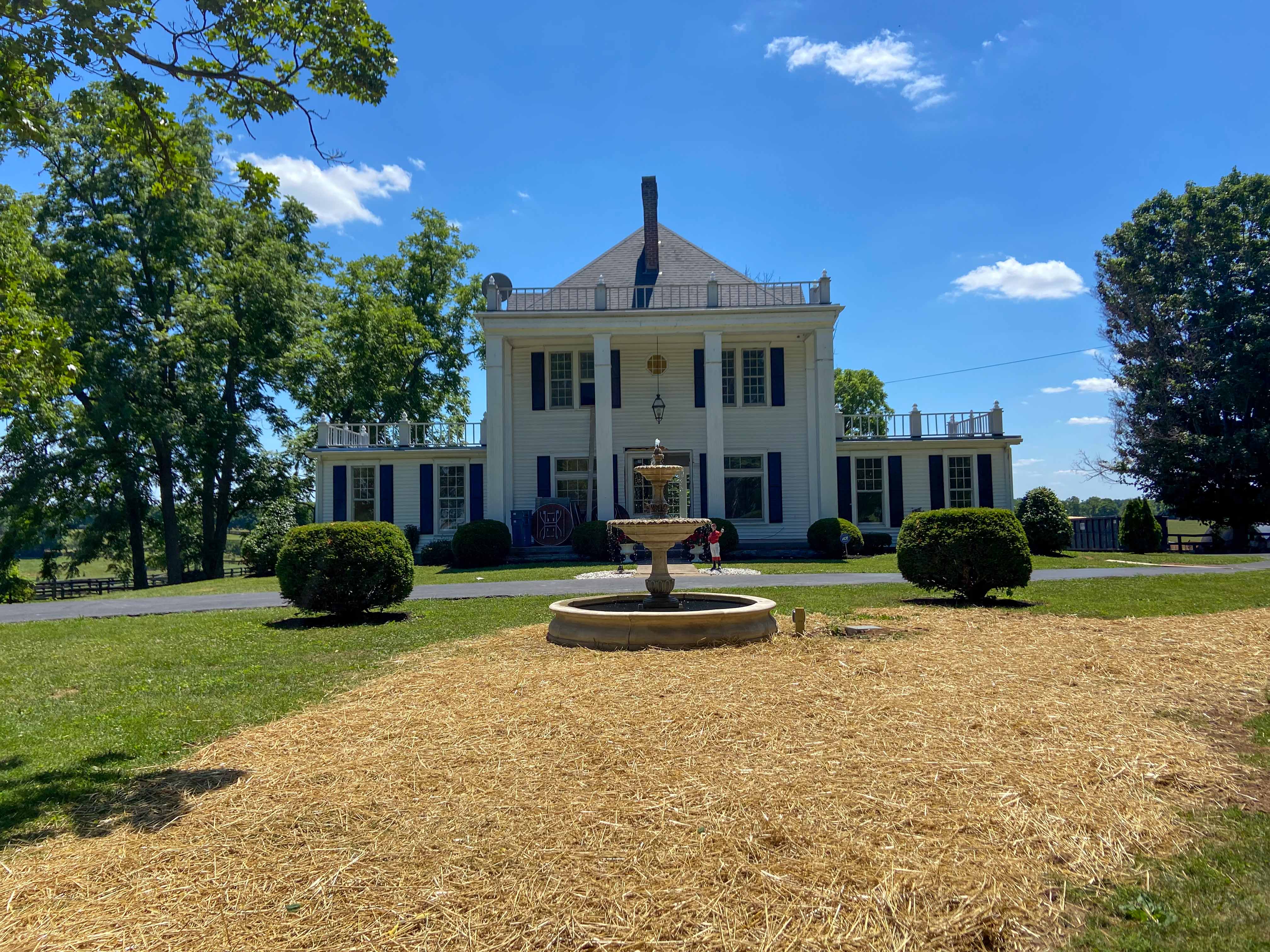 fountain in front of a lexington house