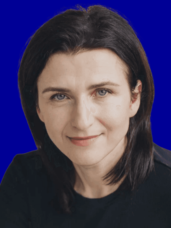 Close-up of a dark green leaf showing its textured surface and central vein against a muted background.