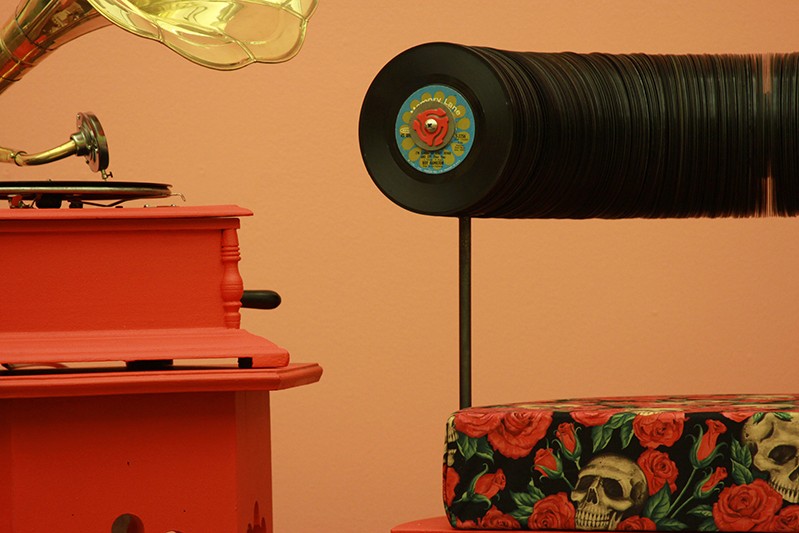 unique chair made with skull and roses sit and vinyl disks