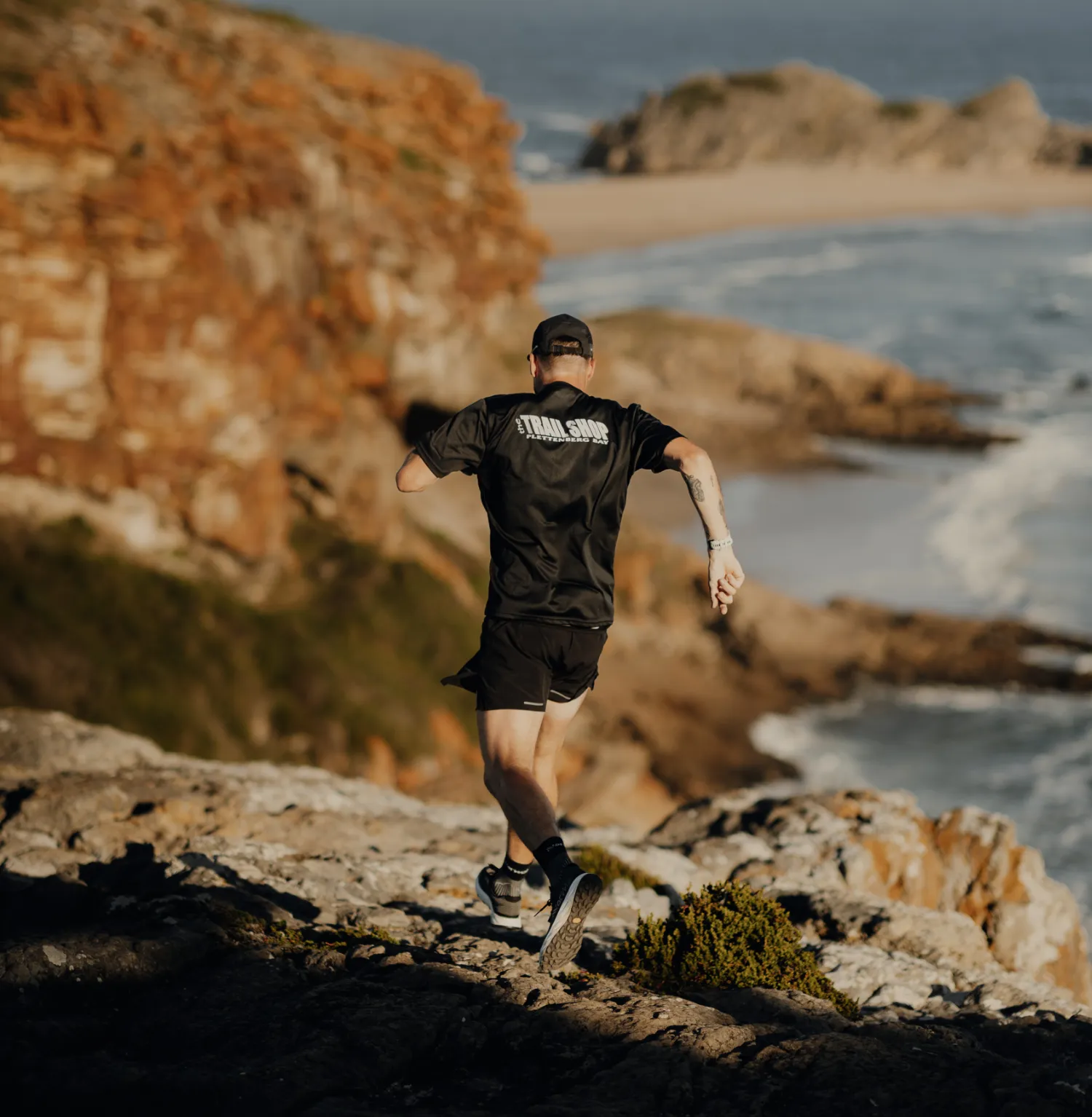 Johnny Wolf of the Trail Shop running along Robberg 