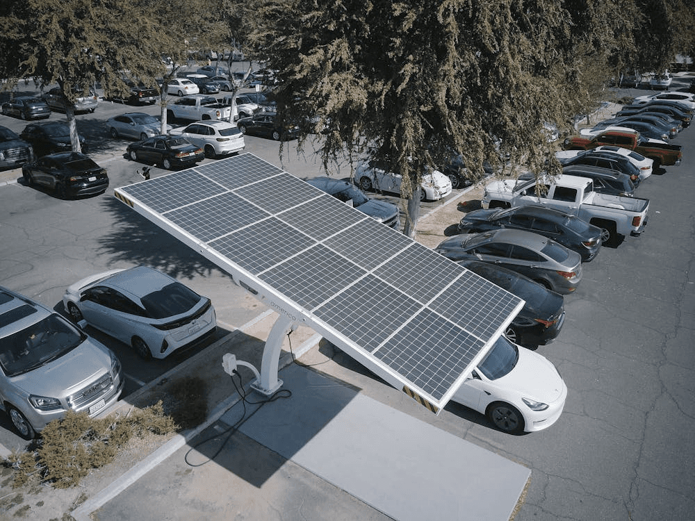 A solar panel in a parking lot of a facility, highlighting how facilities managers need to better focus on energy efficiency practices for their portfolios.