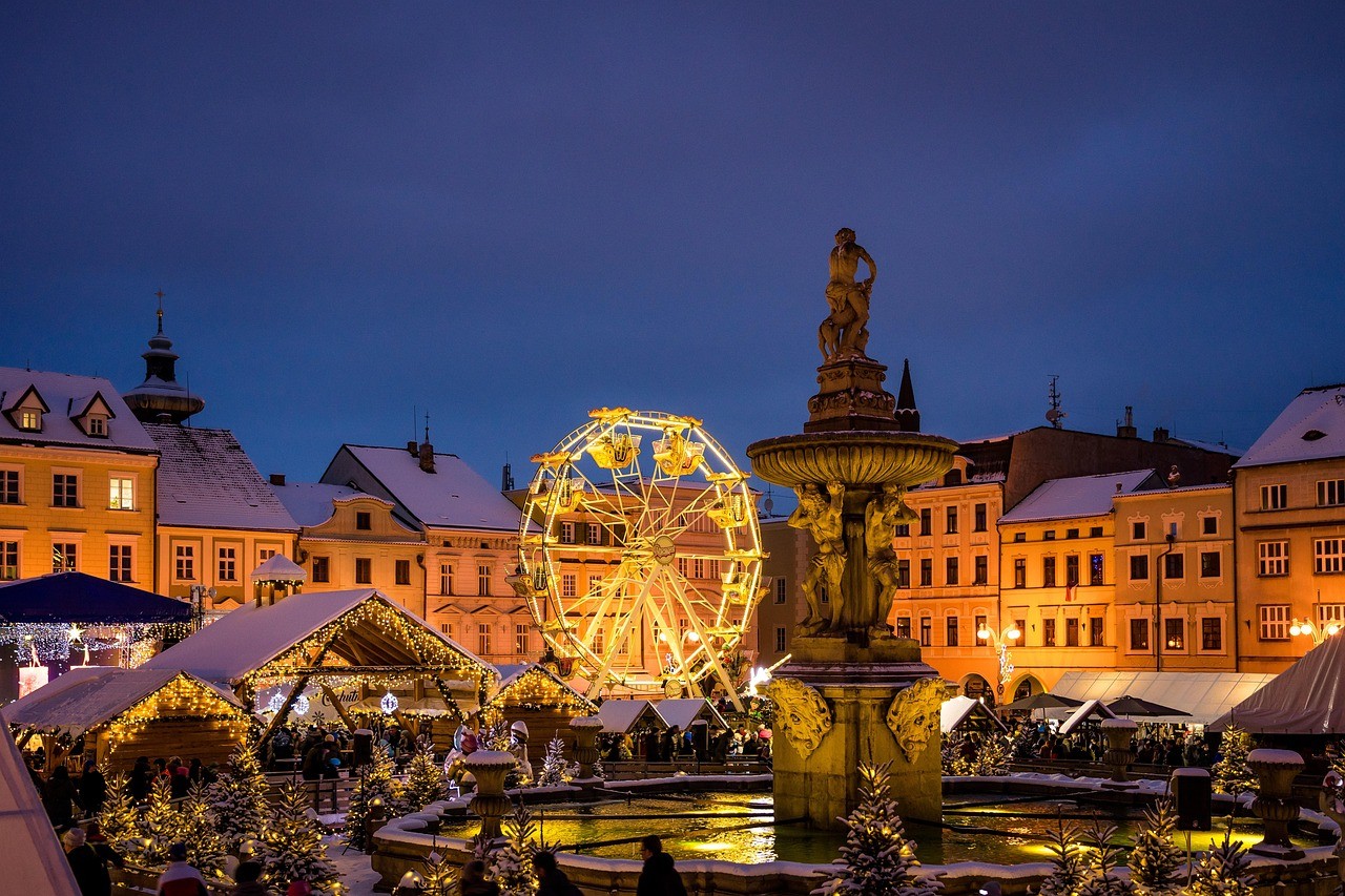 an aerial view of a christmas market at night