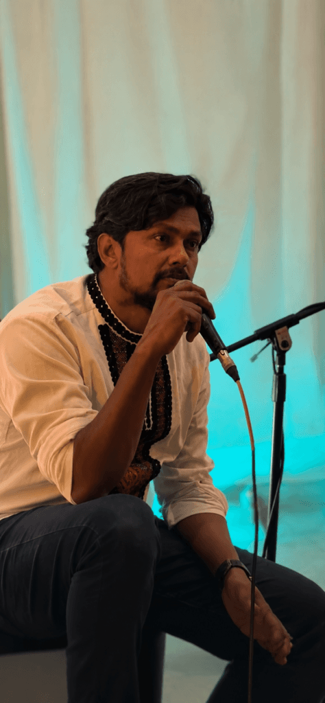 Poet performing spoken word poetry during an intimate live event in Pune