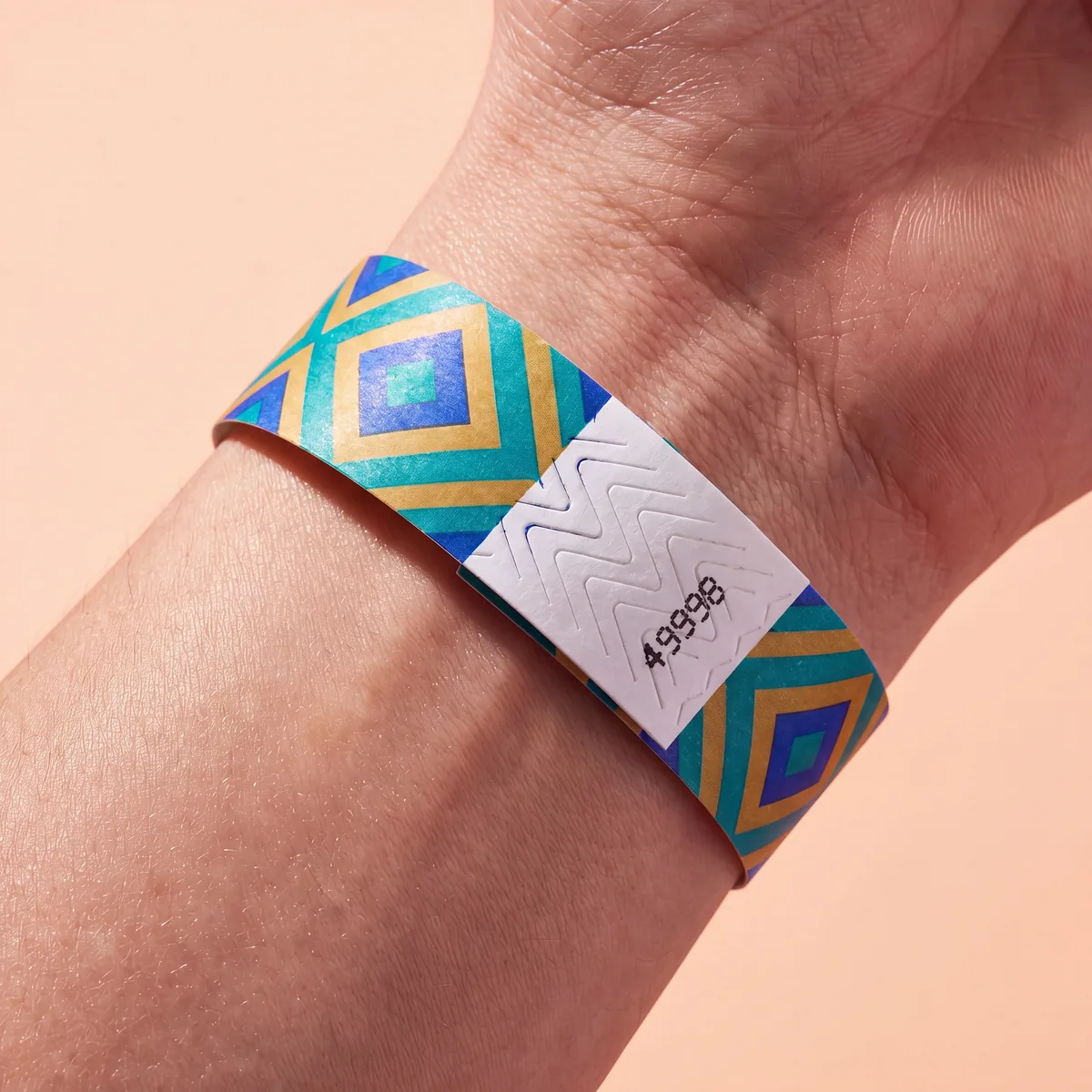 Tyvek wristband with diamond pattern worn on the wrist