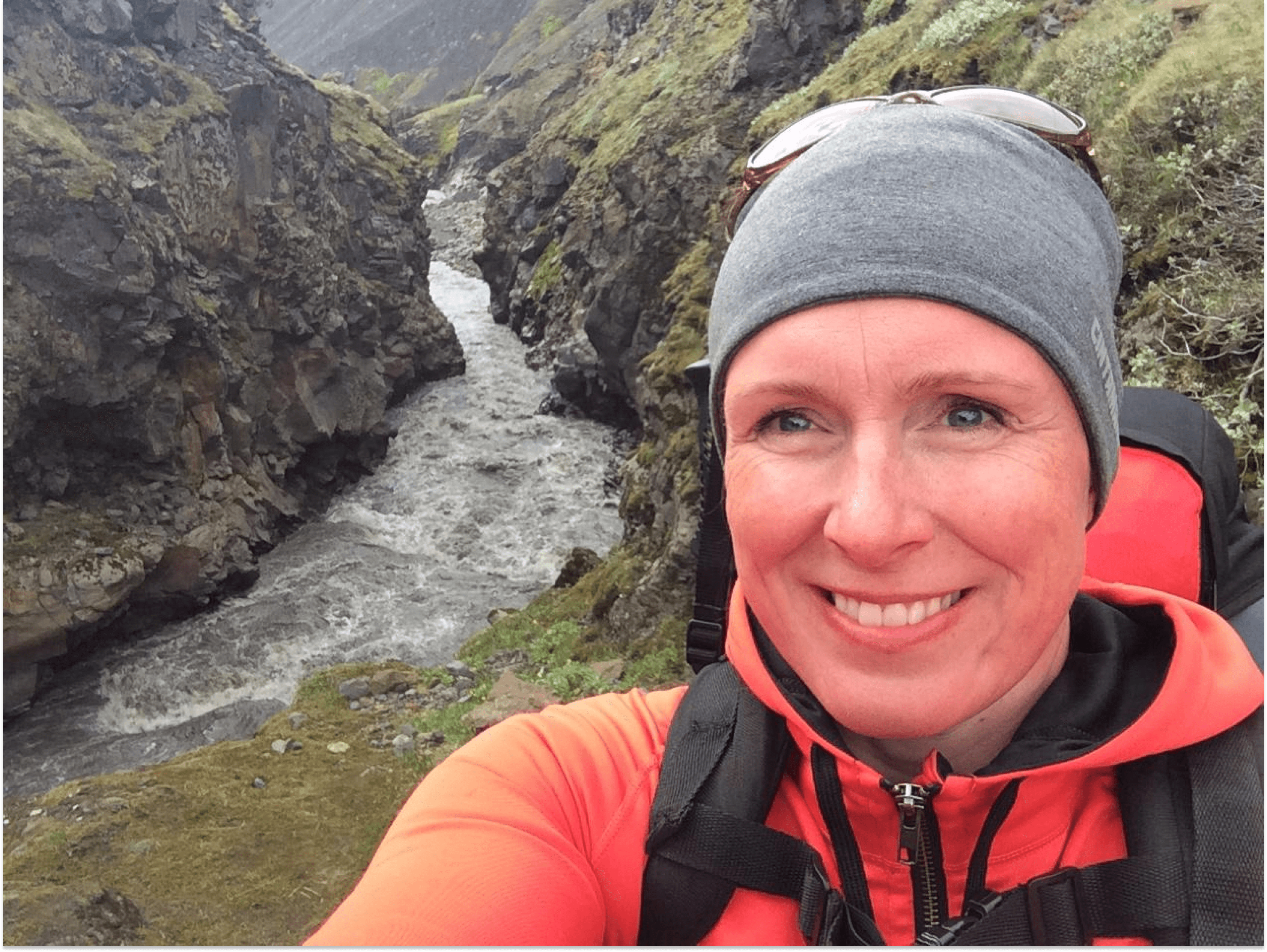 A woman in front of a canyon
