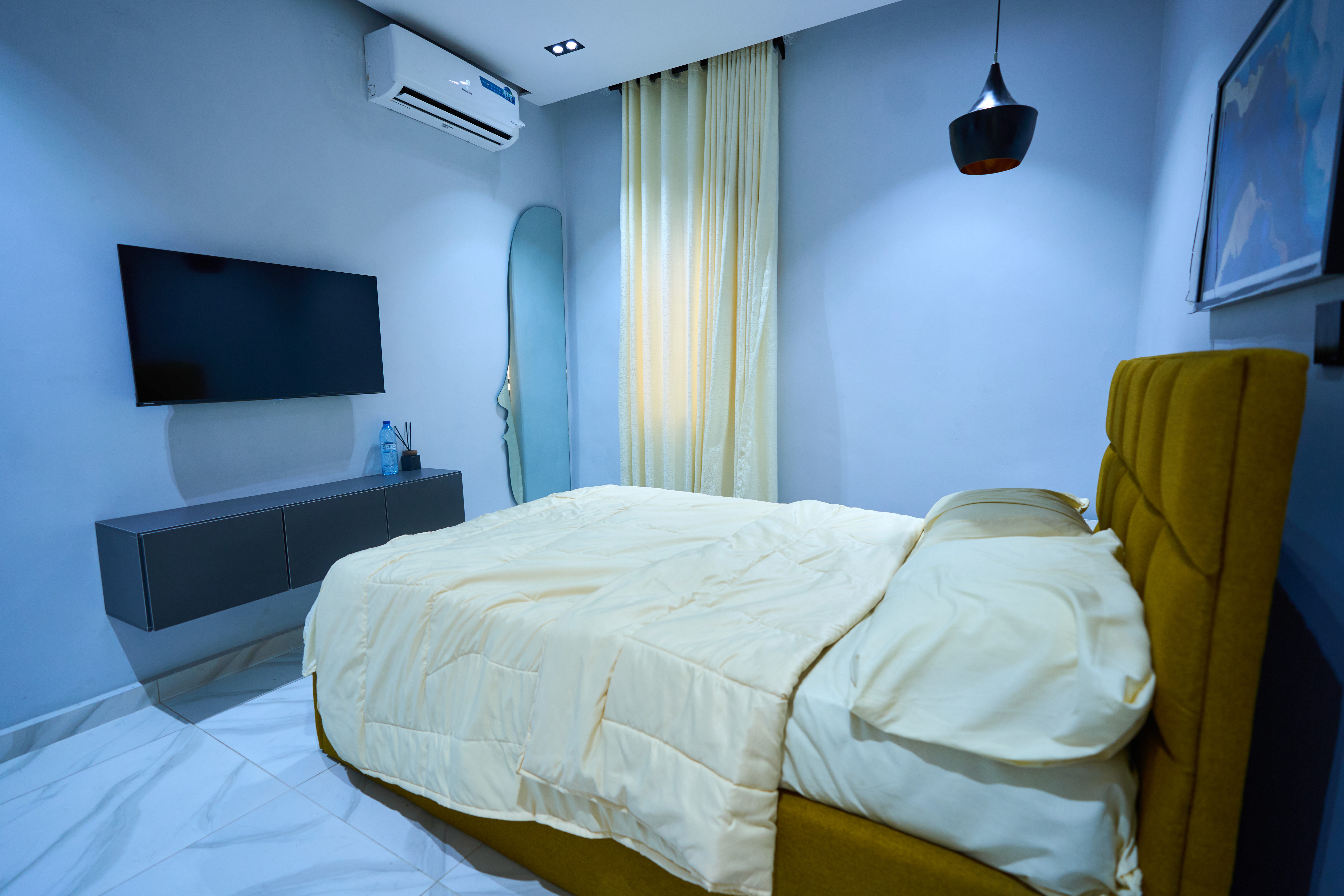 Spacious bedroom interior at Urban Suites, modern shortlet apartment in Surulere, Lagos