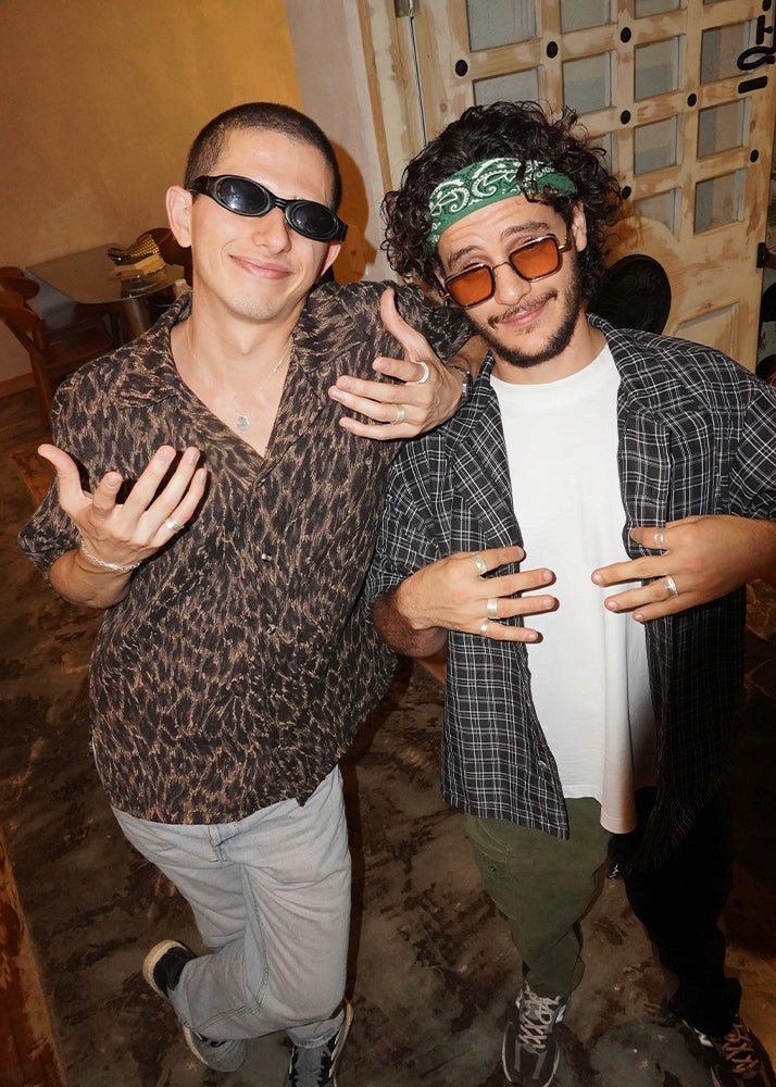 Two friends wearing silver jewelry 