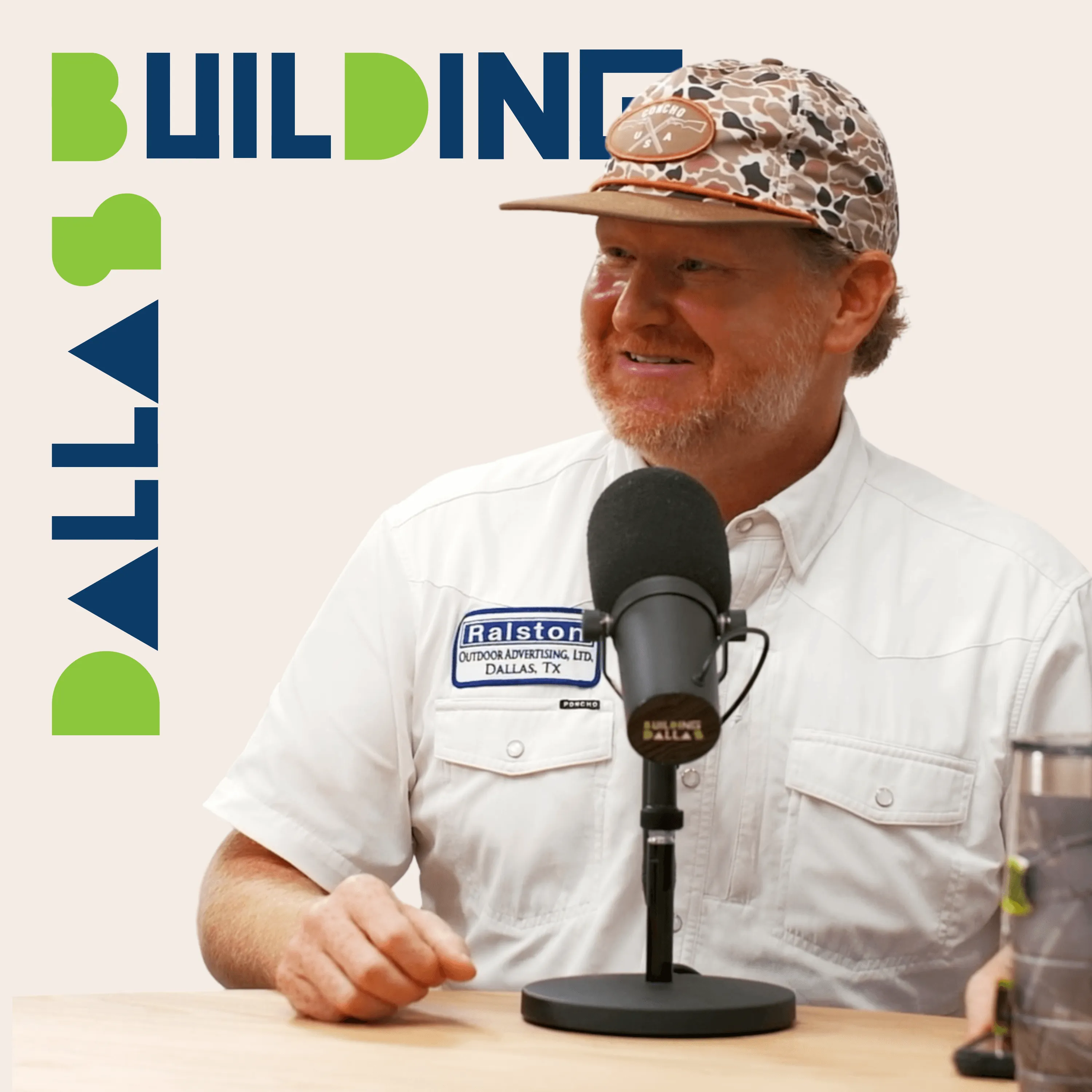 guest speaking into microphones with “Building Dallas” branding