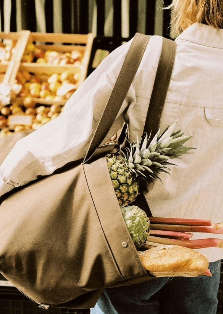 Waiter holding pizza boxes