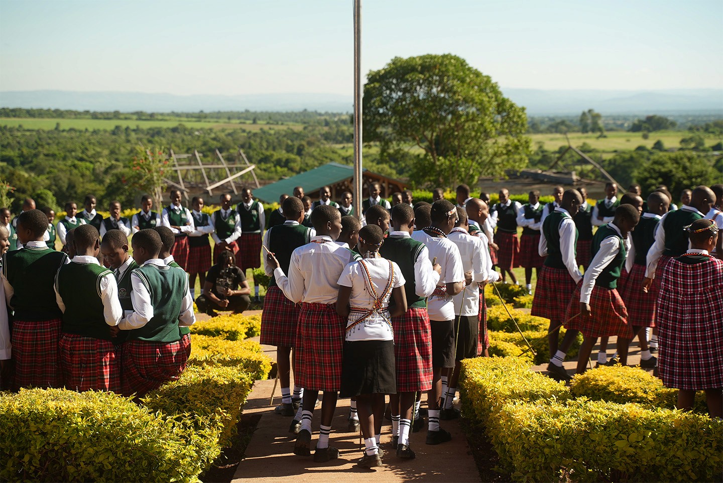 A group of school girls walking outside their school, Kenya