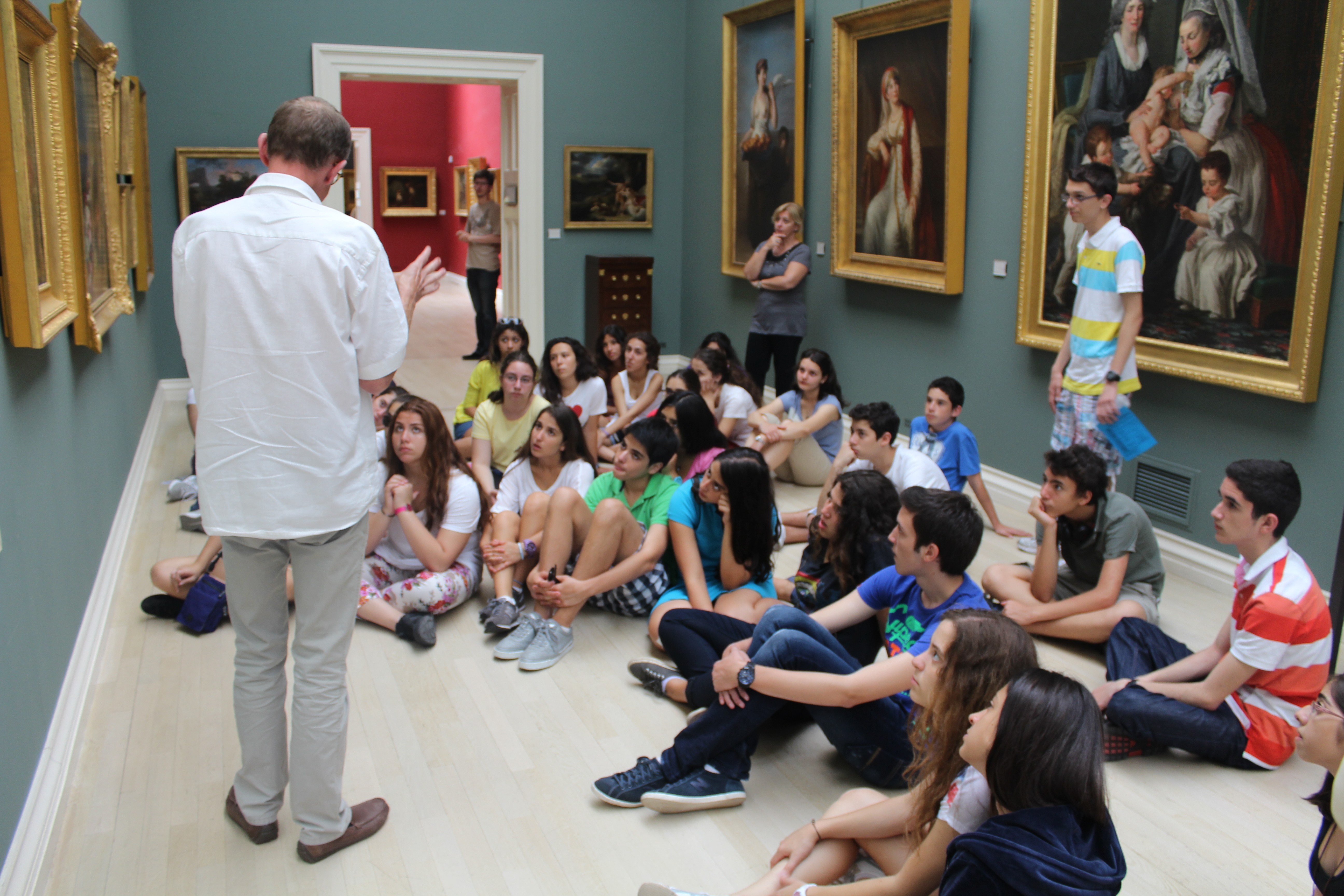 Athletes resting on a track after training.