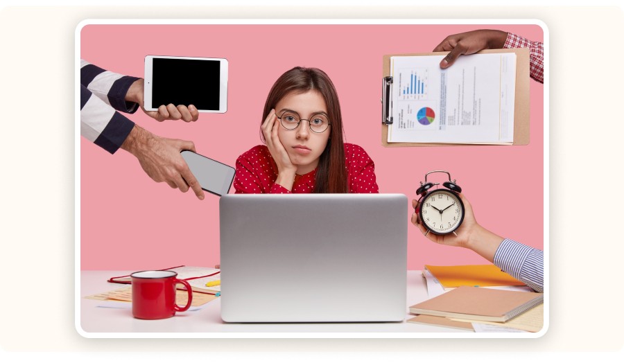 Overwhelmed woman sitting at a laptop
