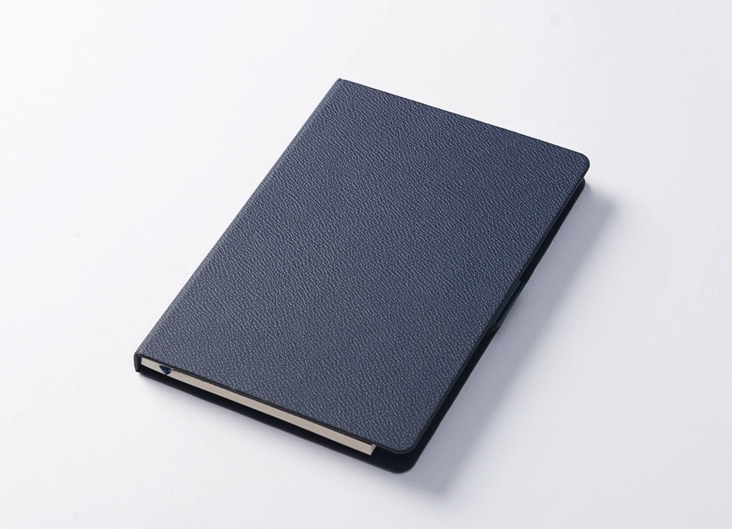 Closed textured leather journal cover in navy blue