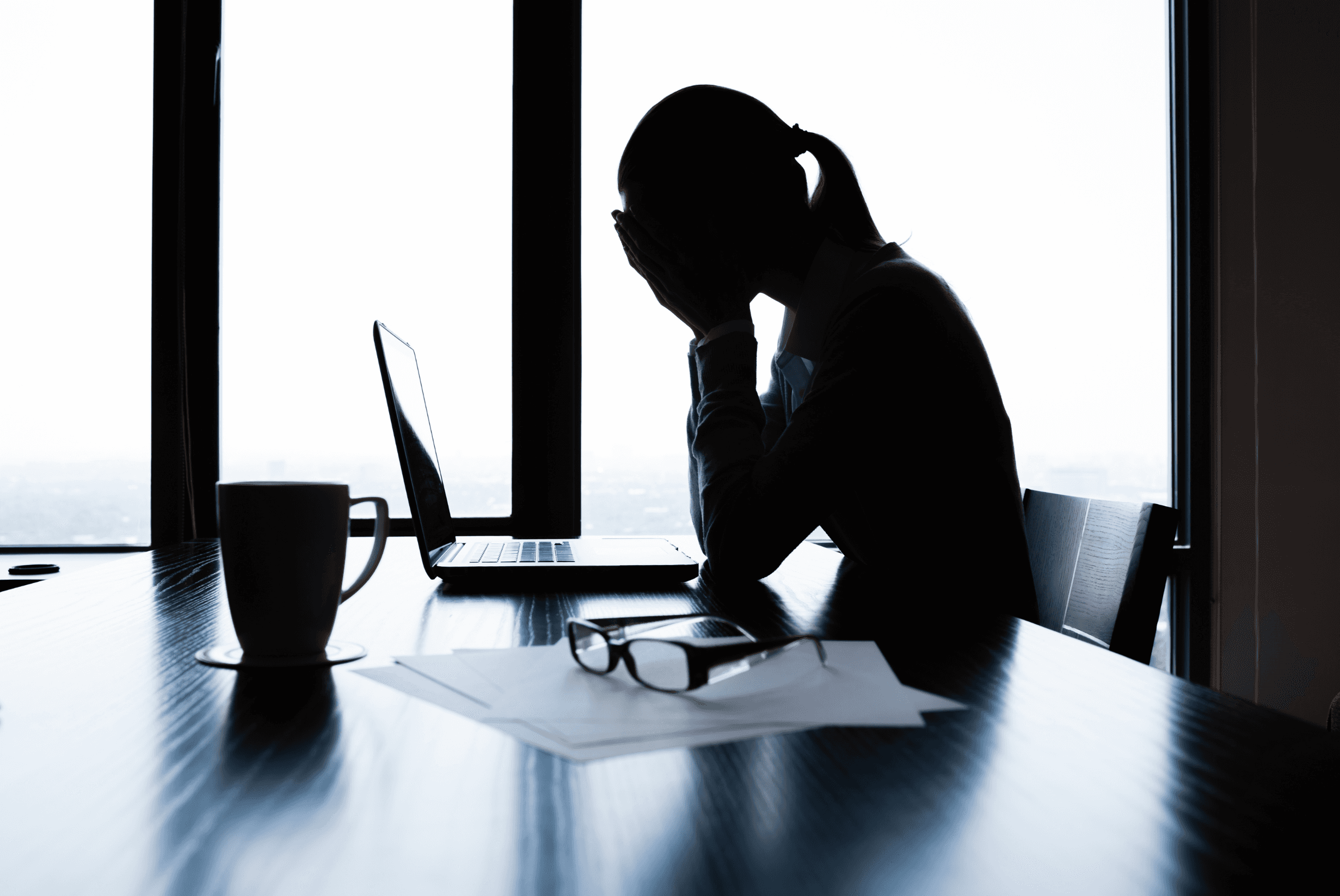 person sitting in a chair in front of a man