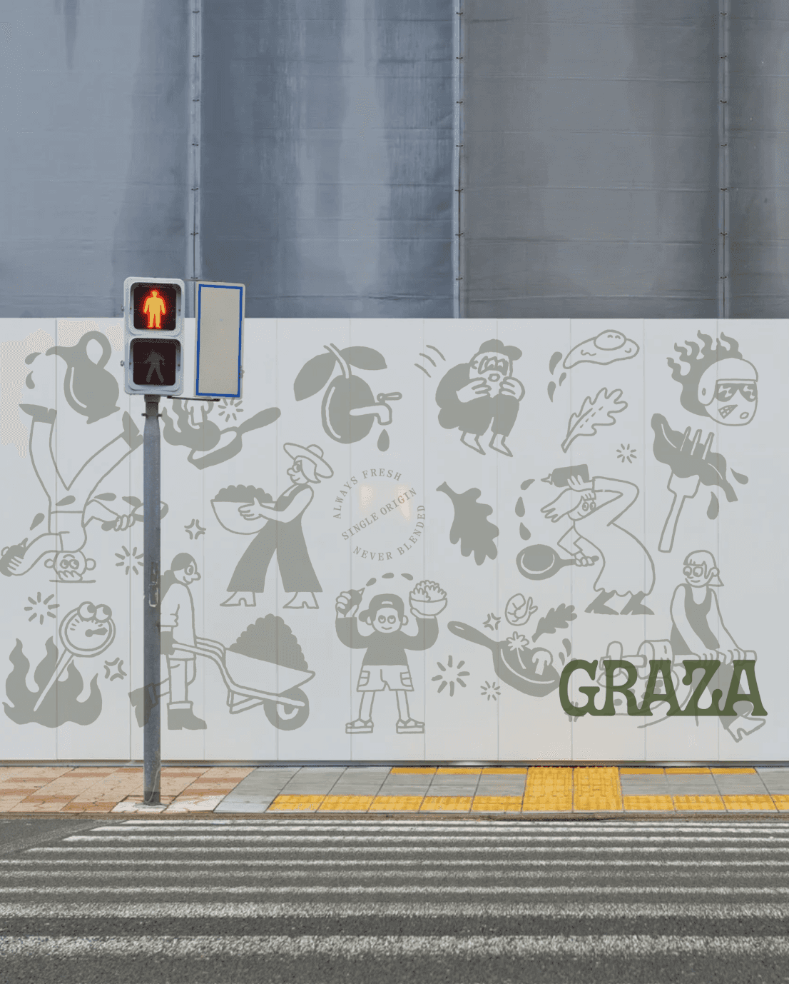 Graza street-wall installation concept showing food-inspired illustrations across a tiled wall beside a pedestrian crossing.