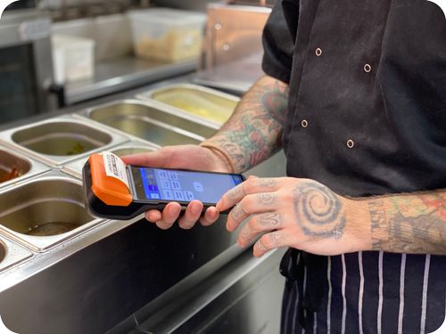 The founders of Labl.it, Rhys and Kyle, stood in their newly opened Smugglers restaurant in 2018.