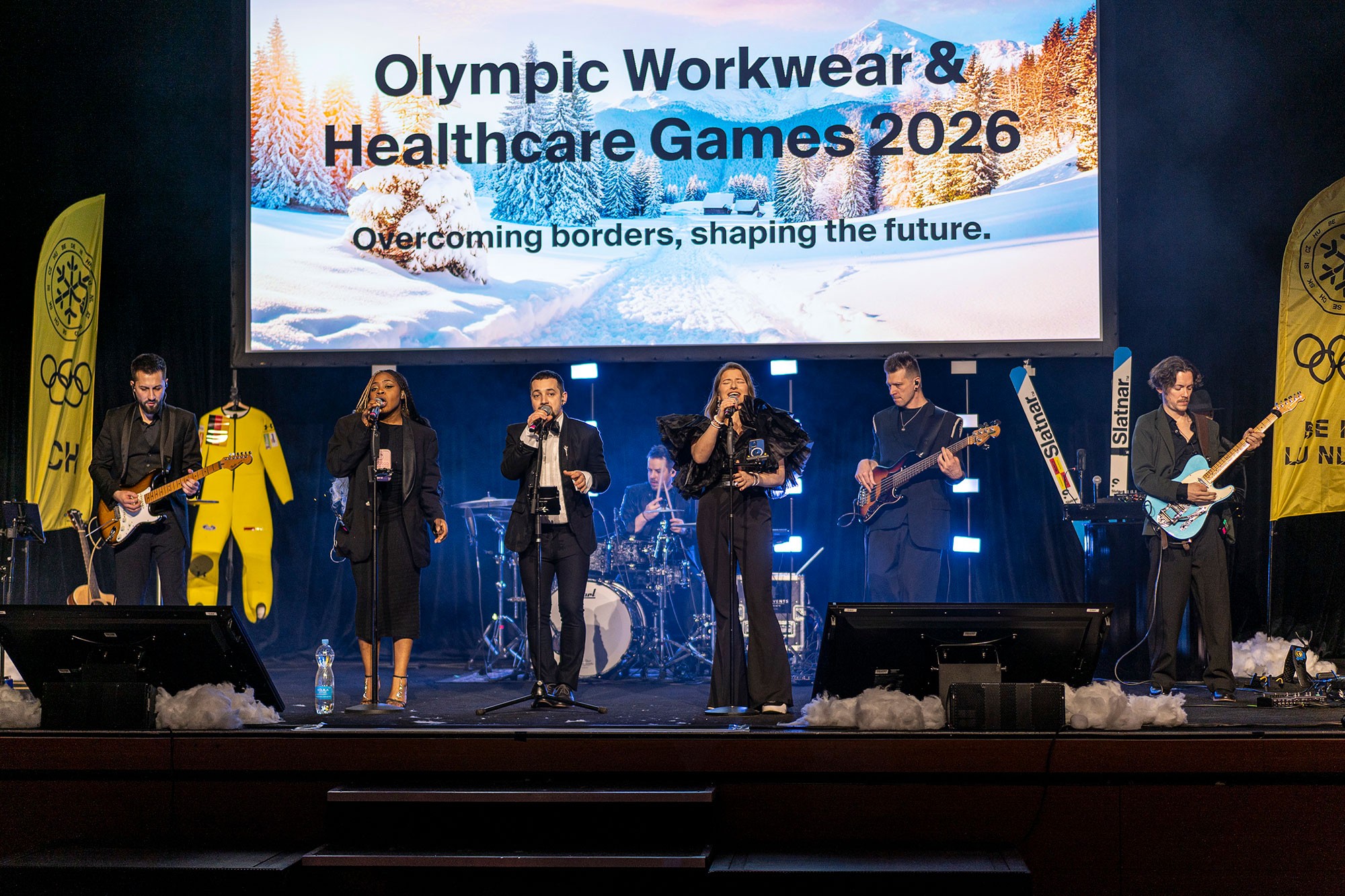 Live band performing during corporate conference gala evening program.