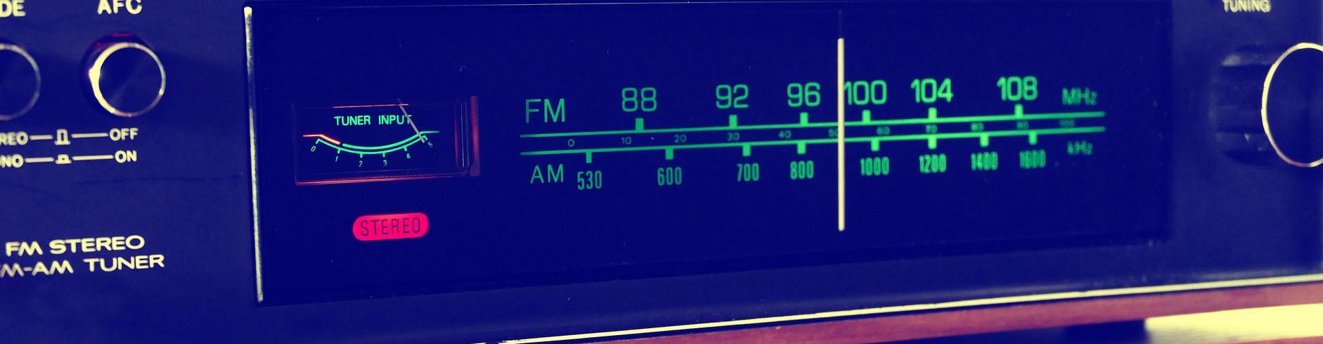 TPV hero banner with faded retro tuner background