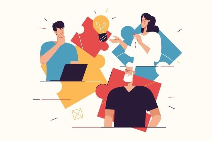 Illustration of three people collaborating in front of colorful puzzle pieces, symbolizing teamwork, idea generation, and the key phases of the adaptive software development process.