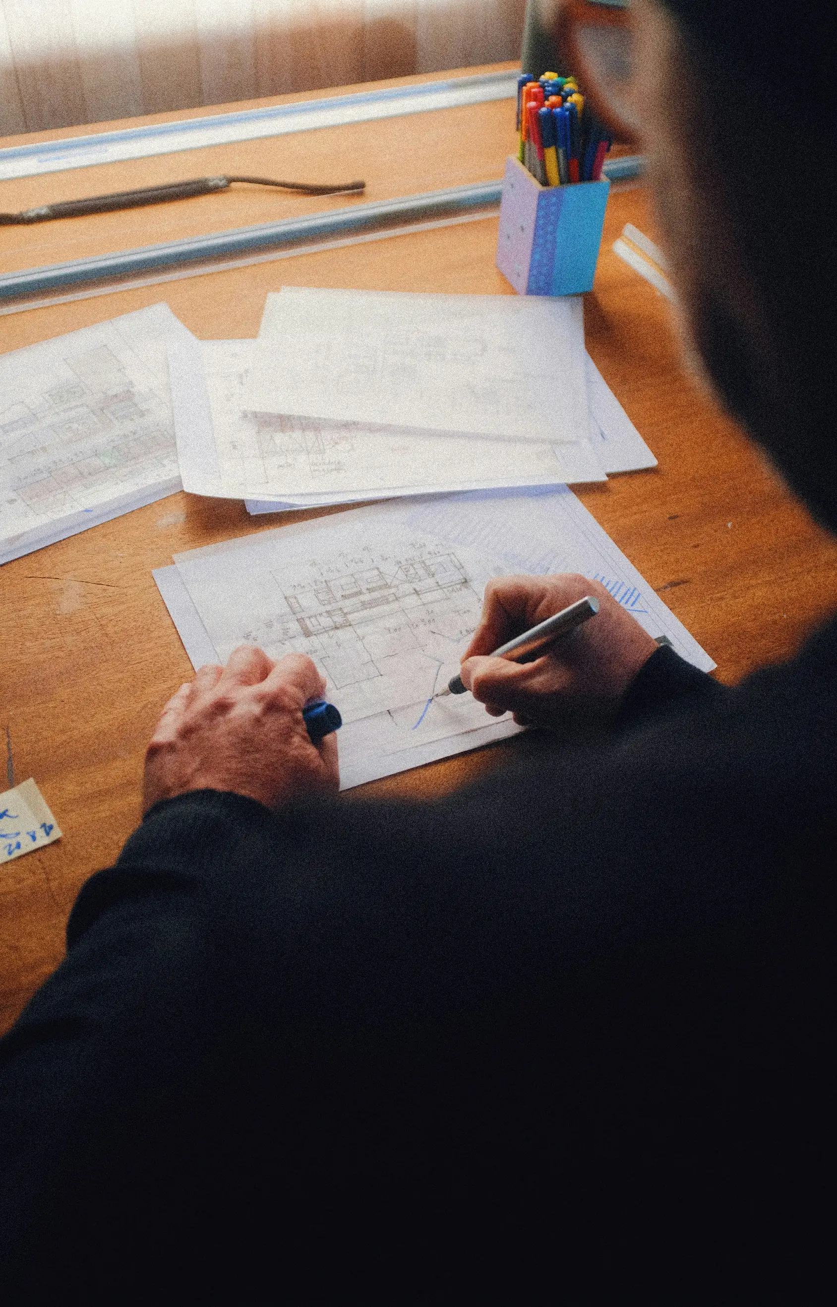 person writing on white paper