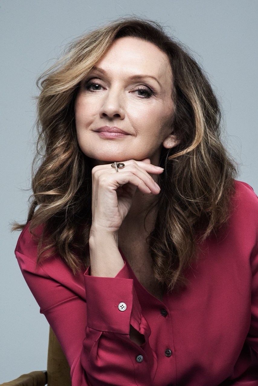 person sitting in a chair in front of a man